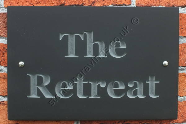 The retreat house sign in Welsh slate. Font engravers Times, lettering left natural (unpainted).